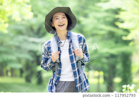 Middle-aged woman enjoying hiking 117952793