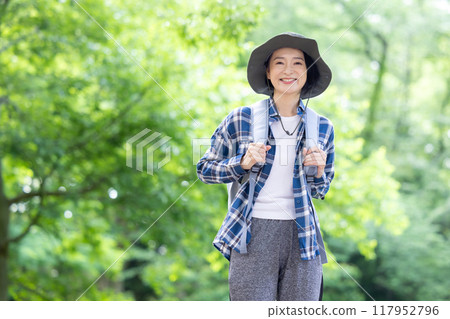 Middle-aged woman enjoying hiking 117952796