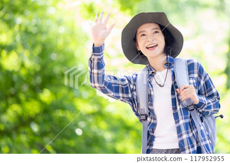 Middle-aged woman enjoying hiking 117952955