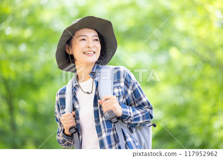 Middle-aged woman enjoying hiking 117952962