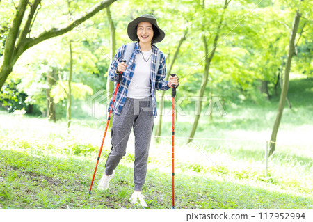 Middle-aged woman enjoying hiking 117952994
