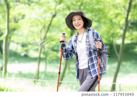 Middle-aged woman enjoying hiking 117953049