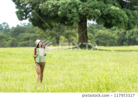 Women hiker or traveler with backpack adventure find directions Women hiker or traveler with backpack adventure find directions 117953327