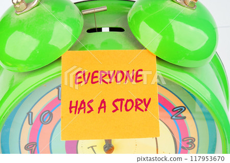 Business, technology, internet concept. EVERYONE HAS A STORY message written on the sticker on the background of the alarm clock 117953670