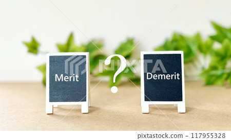 Two signs with the words Merit and Demerit, a question mark and a plant on an off-white background 117955328