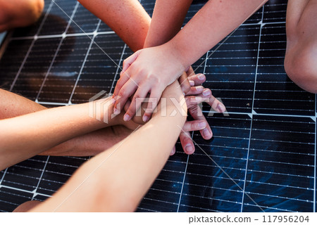 Hands on solar panel. Rooftop solar or photovoltaic system. Sustainable future for next generation. Hands on solar panel. Rooftop solar or photovoltaic system. Sustainable future for next generation. 117956204