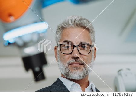 Automation, robotics engineer working on robotic knee replacement surgery project. Concept of modern technology in medicine, automated processes, healthcare. 117956258