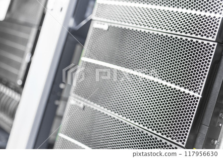 detail of rack datacenter holding cluster of hard-drives 117956630
