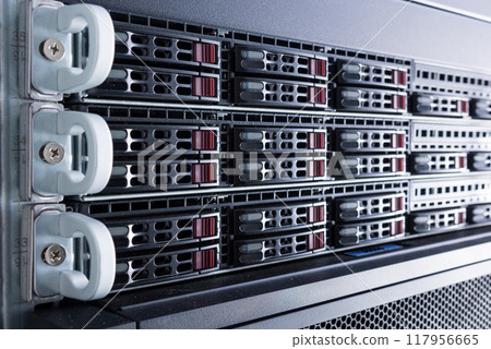 Row of hard drives serving as data storage inside server room Row of hard drives serving as data storage inside server room 117956665