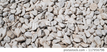 a pattern of white pebbles, a surface of white and gray gravel, 117956796