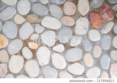 Detailed close-up of a white pebble stone path Detailed close-up of a white pebble stone path 117956821