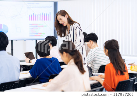 Young men and women receiving a seminar 117957205