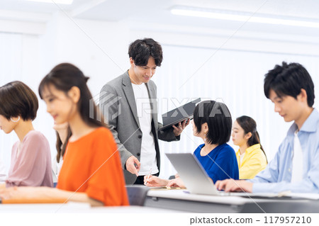 Young men and women receiving a seminar 117957210