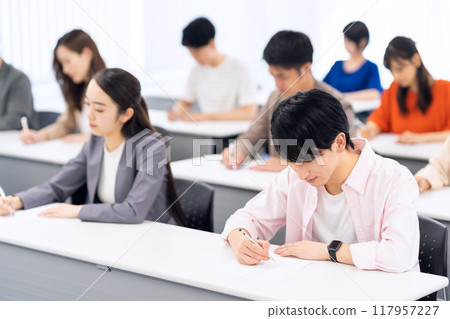 Young men and women receiving a seminar Young men and women receiving a seminar 117957227