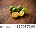 Picking oranges 117957395