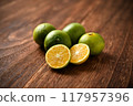 Picking oranges 117957396