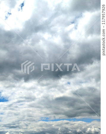 Fluffy White Clouds in a Blue Sky as A Skyscape Background Fluffy White Clouds in a Blue Sky as A Skyscape Background 117957926