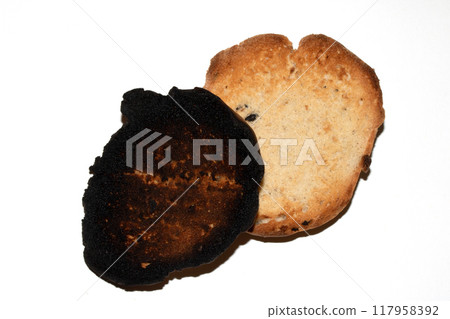 Very Burnt Bread Roll Toast and a Lightly Toasted Close Up Texture Close Up Very Burnt Bread Roll Toast and a Lightly Toasted Close Up Texture Close Up 117958392