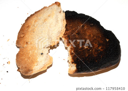 Very Burnt Bread Roll Torn or Cut in Half Toast Close Up Texture Very Burnt Bread Roll Torn or Cut in Half Toast Close Up Texture 117958410