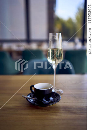 espresso coffee and sparkling wine, prosecco on the table 117958601