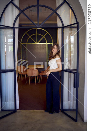 16-year-old teenage girl in old money style clothes in a fancy restaurant 16-year-old teenage girl in old money style clothes in a fancy restaurant 117958759