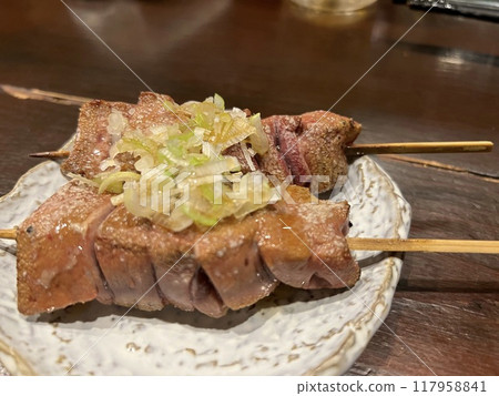 Grilled liver skewers on a plate 117958841