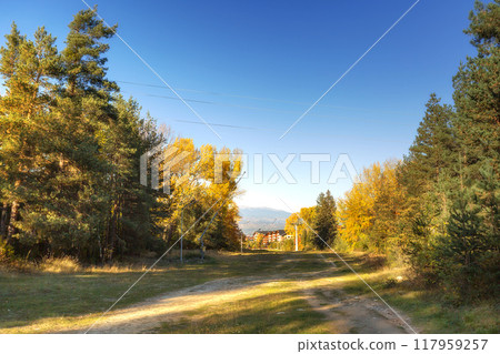 Bansko, Bulgaria autumn landscape, ski road path Bansko, Bulgaria autumn landscape, ski road path 117959257