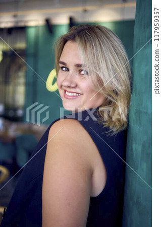 a middle-aged plus size woman in old money style clothes in a fancy restaurant a middle-aged plus size woman in old money style clothes in a fancy restaurant 117959357