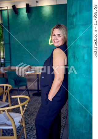 a middle-aged plus size woman in old money style clothes in a fancy restaurant a middle-aged plus size woman in old money style clothes in a fancy restaurant 117959358