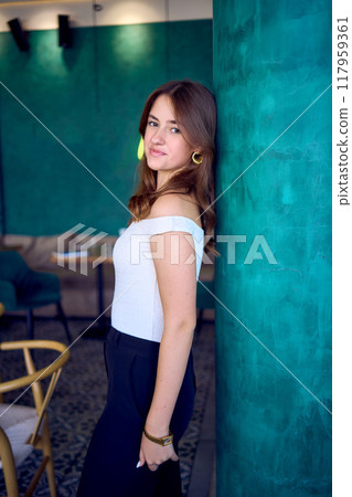 a 16-year-old teenage girl in old money style clothes in fancy restaurant a 16-year-old teenage girl in old money style clothes in fancy restaurant 117959361