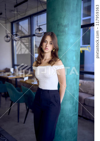 a 16-year-old teenage girl in old money style clothes in fancy restaurant a 16-year-old teenage girl in old money style clothes in fancy restaurant 117959363