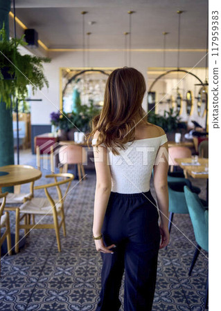 a 16-year-old teenage girl in old money style clothes in fancy restaurant a 16-year-old teenage girl in old money style clothes in fancy restaurant 117959383