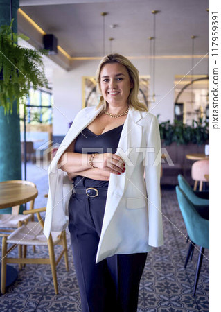 a portrait of middle-aged plus size woman in old money style clothes in a fancy restaurant a portrait of middle-aged plus size woman in old money style clothes in a fancy restaurant 117959391
