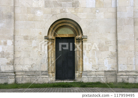 Door on the stone wall 117959495