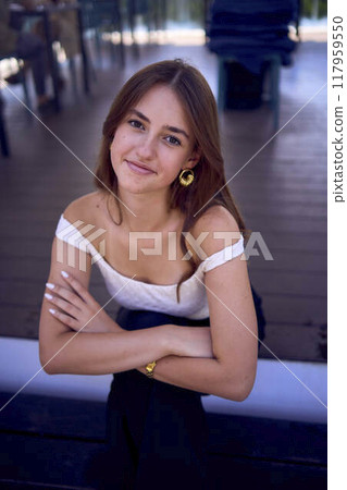 a portrait of 16-year-old teenage girl in old money style clothes in fancy restaurant a portrait of 16-year-old teenage girl in old money style clothes in fancy restaurant 117959550