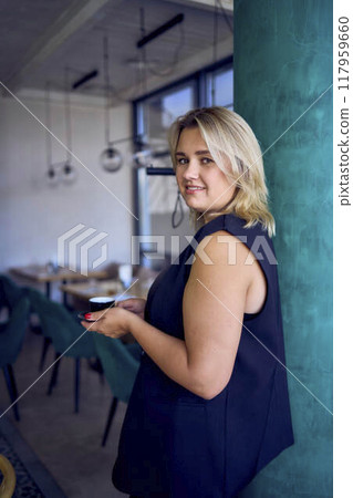 a middle-aged plus size woman in old money style clothes in a fancy restaurant a middle-aged plus size woman in old money style clothes in a fancy restaurant 117959660
