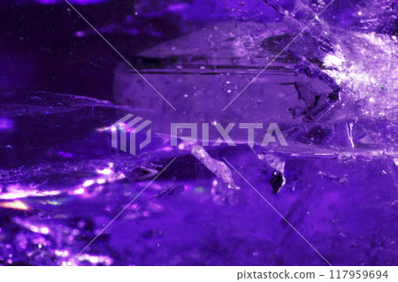 Close Up of a Rock Crystal with inclusions in Putple blue Rainbow Close Up of a Rock Crystal with inclusions in Putple blue Rainbow 117959694