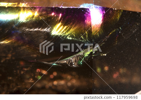 Close Up of a Rock Crystal with inclusions in Putple blue Rainbow 117959698