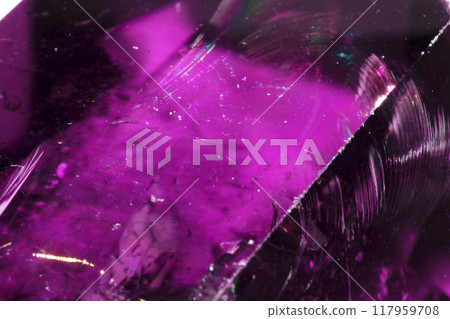 Close Up of a Rock Crystal with inclusions in Putple blue Rainbow 117959708