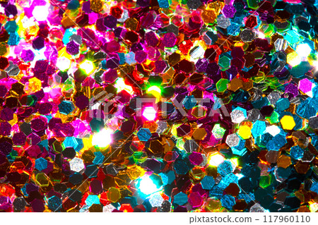 Close Up of Color Shiny Confetti Glitter On White Background Close Up of Color Shiny Confetti Glitter On White Background 117960110