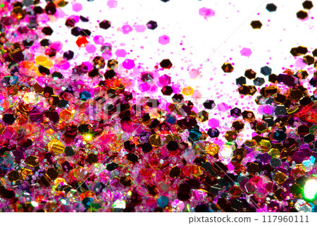 Close Up of Color Shiny Confetti Glitter On White Background Close Up of Color Shiny Confetti Glitter On White Background 117960111