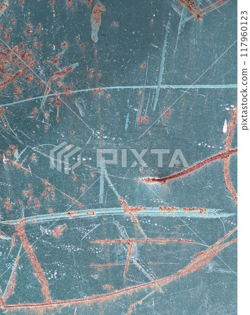 Rusted and Scratched Painted Metal Background in a Rust and Blue Green Color Rusted and Scratched Painted Metal Background in a Rust and Blue Green Color 117960123