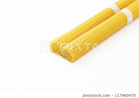 Spaghettini on white background Spaghettini on white background 117960470
