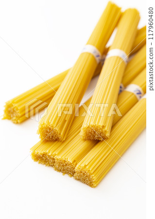 Spaghettini on white background Spaghettini on white background 117960480