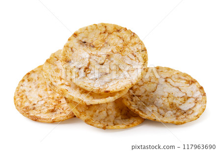 Heap rice chips close-up on white. Isolated 117963690