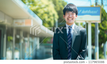 Business person standing in front of a store 117965086