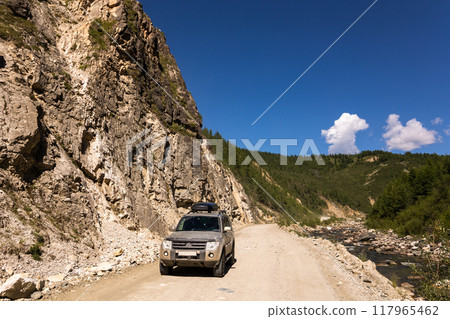 Japanese SUV near a mountain river 117965462