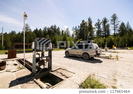 Japanese Suv at abandoned gas station 117965464