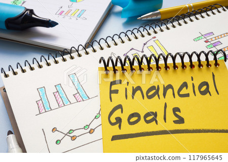 Notebook with financial goals on a table. Personal finance planning. 117965645