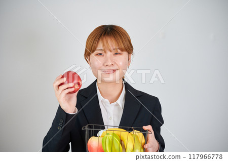 Smiling woman holding fruit 117966778